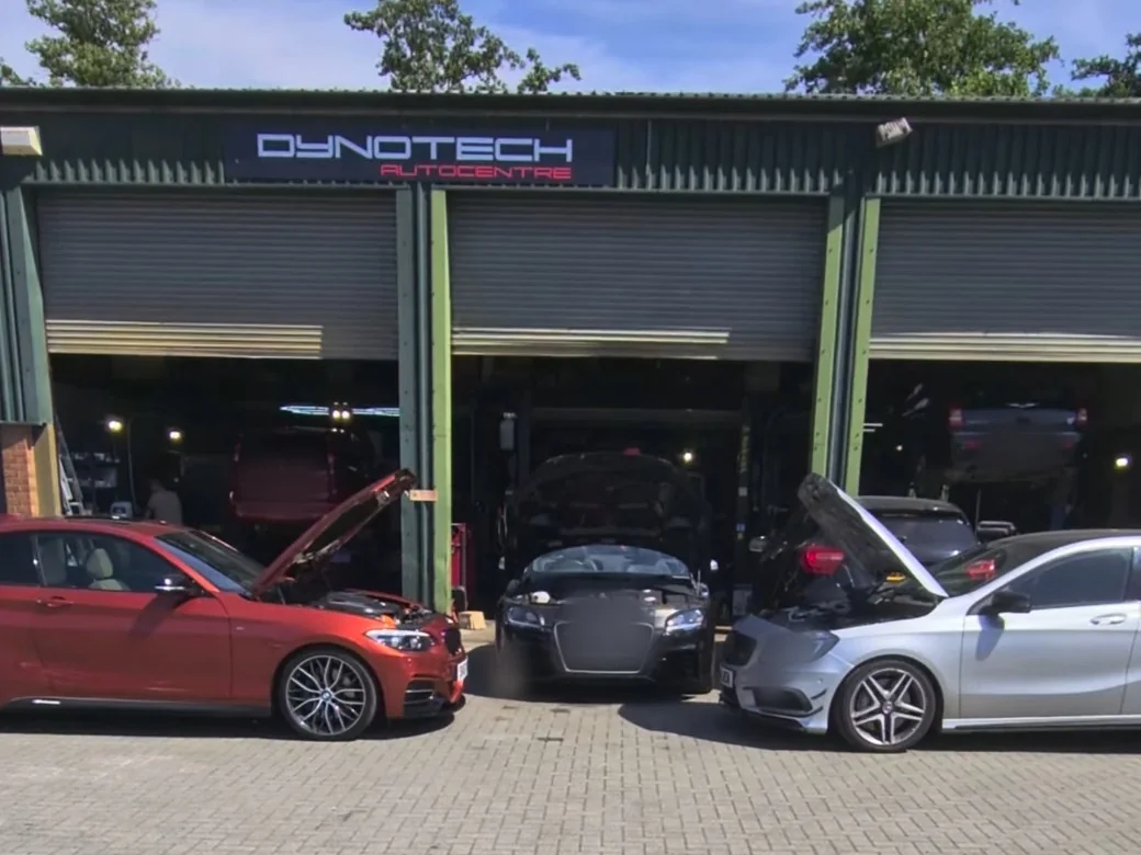 The front of the Dynotech workshop with its sign and the doors open